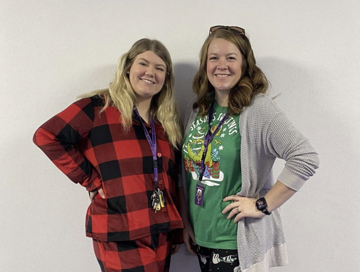 Media center specialists Jess Martin and Heather Cox dress up for Christmas spirit week Dec. 11. The theme was Baby, It’s Cold Outside, or dress in Christmas pajamas. 